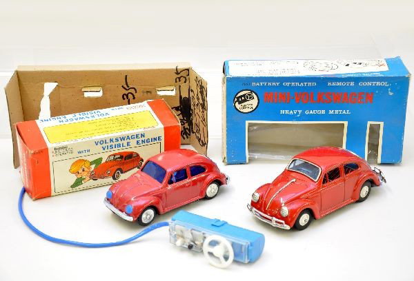 2 Boxed Bandai VW Beetles: 8" Early 1960s Beetle, battery operated, functional with visible motor, forward and reverse; 7" late 1960s Bug, battery operated, functional, mechanical steering, forward and reverse. Both have origin