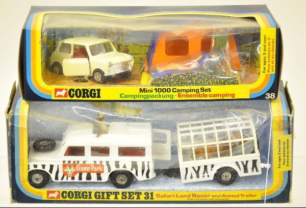 Boxed Corgi Gift Sets 31 & 38: Set 31 includes Safari Land Rover and animal trailer, Set 38 has Mini 1000 camping set. Original boxes with inserts, dirty cellophane, vehicles are mint. C9