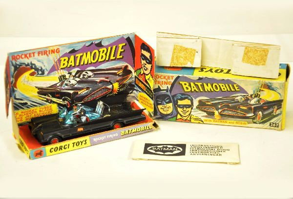 Beautiful Boxed Corgi 267 Batmobile: Vehicle is mint includes sealed packet with accessories and insert. Display insert is bright and clean with wear to one corner. Original box shows some shop wear, C9