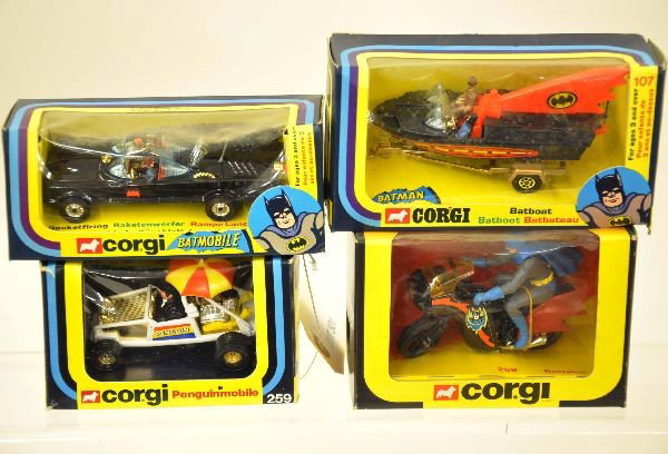 4 Boxed Corgi Batman Vehicles: 259 Penguinmobile, 267 Batmobile, 107 Batboat with figures, 268 Batbike. Vehicles are mint with original boxe, dirty cellophane, C9