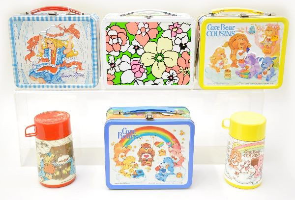 Girly Lunch Boxes: Ohio Art 1971 Floral lunch box, like new; Aladdin Industries 1985 Care Bear Cousins with plastic thermos and original store tag, like new; 1983 Care Bears, showing light wear; Junior Miss 1971, with p
