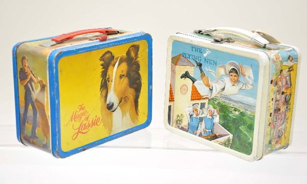 Lassie and Flying Nun Lunch Boxes: Lassie, King-Seeley 1978, shows moderate wear; The Flying Nun, Aladdin Industries, 1968 embossed, shows light to moderate wear.