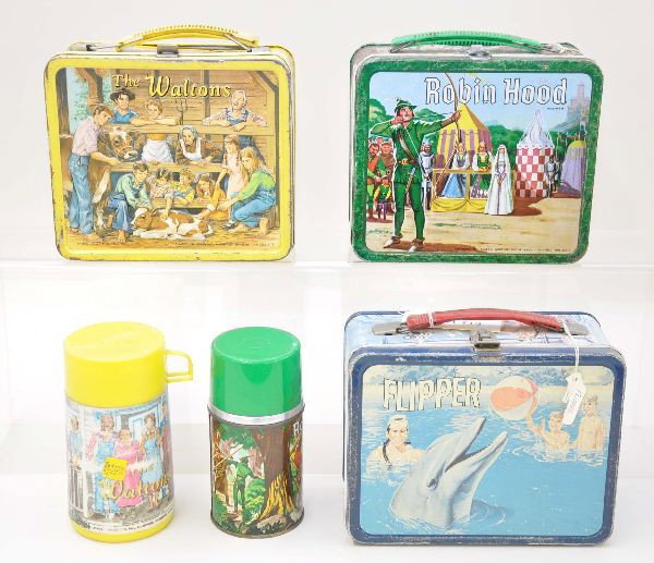 Character Lunch Box Group: The Waltons, Aladdin Industries 1973 embossed with worn plastic thermos; Robin Hood, Aladdin Industries 1956 with metal thermos; Flipper, King-Seeley, 1966. Boxes show moderate wear.