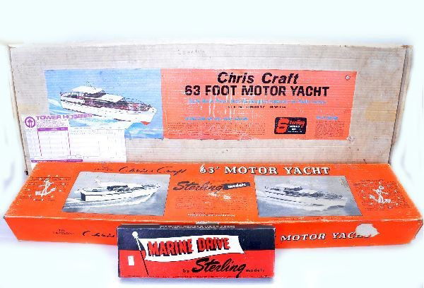Large Boxed Boat Model Kits: 2 Sterling B-11M Chris Craft 63' motor yachts, balsa wood kits, with two different style original boxes. Both are unbuilt and complete with instructions, model is 40" long; Sterling Marine Drive Kit;