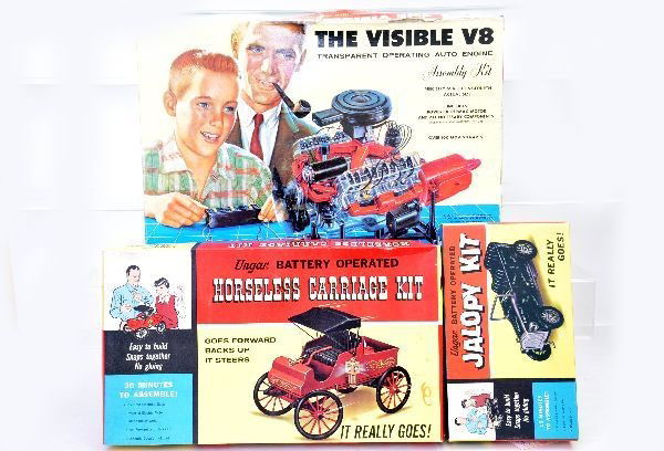 3 Boxed Motorized Model Kits: Ungar battery operated Jalopy Kit with display insert; Ungar Horseless Carriage Kit, battery operated with display insert; Renwal, the Visible V8 engine with individual boxes and instructions. All app
