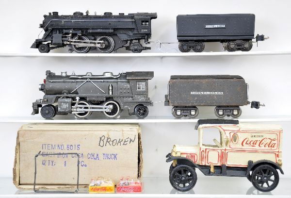 Lionel Pre-War Locomotives Plus: 249E steam locomotive, die cast intact; 265W tender, gun metal C-3; 229 steam locomotive; 2689W tender, shows moderate playwear C6. Plus, reproduction cast iron Coca Cola delivery truck, in box and in