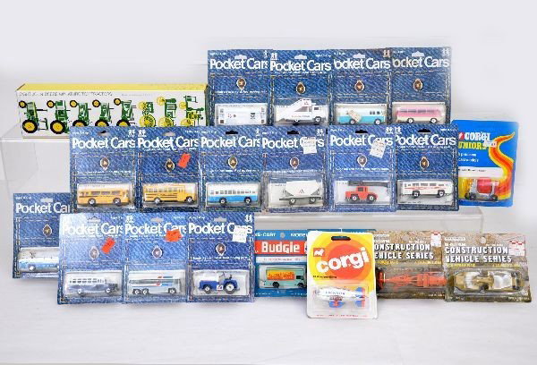 Tomy, Budgie & Corgi Jr. Cars Plus: 14 Tomy Pocket Cars including scarce 4 unit American Airlines set; 2 Budgie vans; Corgi Junior #83 and #20; and 2 construction vehicles. All are on cards, some cards are worn. Vehicles are all C10. Pl