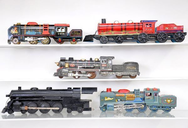 5 Train Toys: Three are Japanese tin, the longest is 15" and one is a Strombecker Hudson wooden kit built up nicely. Otherwise, shows light to moderate wear, C7 The auction containing on the secondary lots will beg
