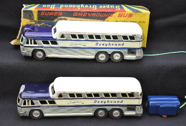 Early Greyhound Bus Toys: Both litho tin, 11" long. One is battery powered (broken tether). It is otherwise like new with a worn original box, C9. The other bus is friction and shows light to moderate playwear, C7