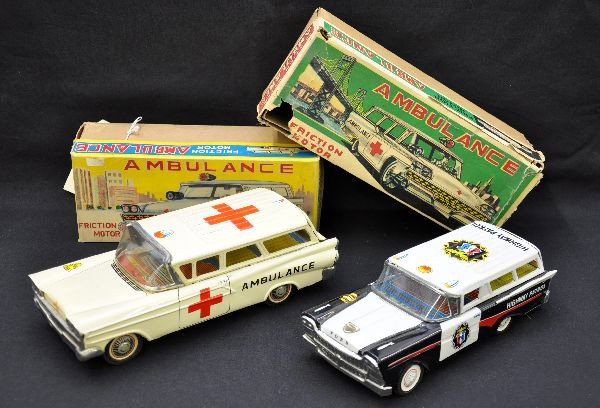 Boxed Japanese Emergency Vehicles: Yonezawa Japan, 10" long 1958 Chevrolet ambulance, like new; K Japan,1958 Ford Highway Patrol wagon, shows light playwear. Both have nice original boxes, C8-9