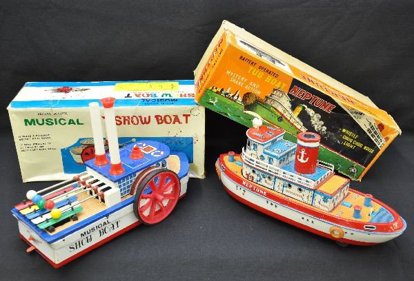 Boxed Boat Battery Toys: Gakken Japan, 14" long musical Show Boat, moves forward with mechanical steering, plays "Oh Suzanna" on xylophone; MT Japan Neptune tug boat, 15" long, lights (repaired), cabin shakes, mystery action 