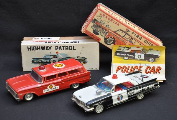 Boxed Japanese Emergency Vehicles: TT Japan, late 1950s, 8 1/2" Fire Chief Station wagon, showing moderate playwear with original box, C6+; super Gabriel 1959 Cadillac Police car, 9" long with original color pamphlet and is like new wi
