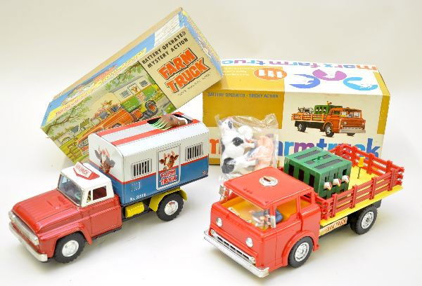 Boxed Farm Trucks Battery Toys: Alps Japan, 11" long, battery operated with mystery action and moving cow, no sound at time of test. Otherwise, toy is like new with its original box, C8+-9; Marx farm truck, 11 1/2" plastic with myst