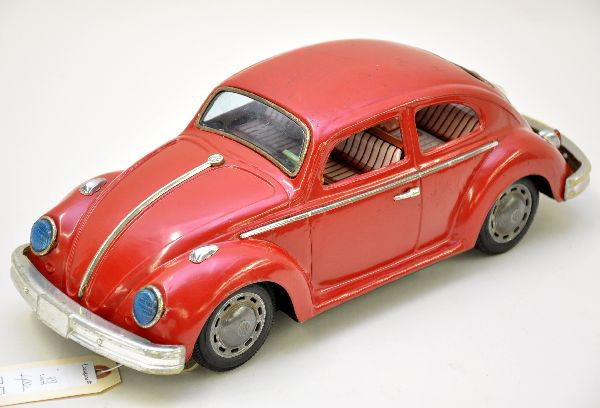 Large Bandai VW Bug Battery Toy: Largest VW Beetle toy we've seen! 16" long, late 1960s styling, battery operated with mystery action (rubber wheels show wear), lighted headlights and motor with realistic interior motor action, rear