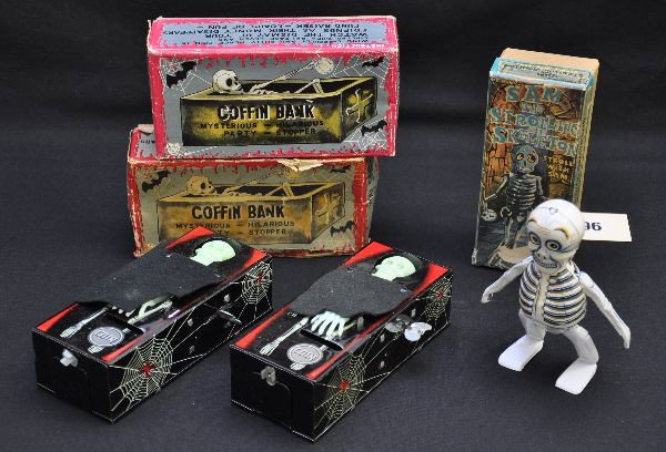 Boxed Skeleton Toys: 2 Yone Japan, coffin banks, mechanisms are functional (not guaranteed); Mikumi Japan, Sam the Strolling Skeleton, 5 1/2" tall, mechanism is functional with his scarce original box. All are like new, C