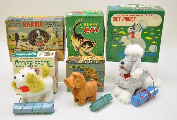 Boxed Japanese Dog & Cat Toys: Yone, cute Poodle, 8 1/2" long, eyes light, walks, yelps and sits; Alps Blinky the Cat, wind-up not working; Alps Barkie, walks, eyes light, pauses, barks; TS Cocker Spaniel, walks & wags tail; TN Jap