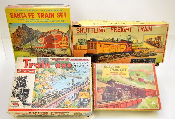 Boxed Japanese Tin Train Sets: Rosko TN Japan HO train set, plastic with litho tin control tower; TN Santa Fe tin diesel set, battery operated; Alps Rock Island steam freight set, battery operated; Alps Shuttling Train with pipe un