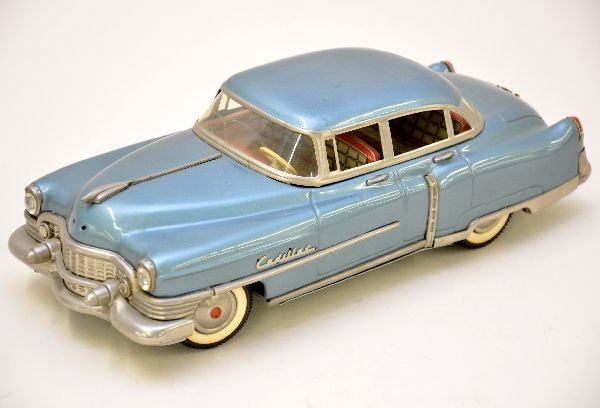 Scarce Gamma 1954 Cadillac Sedan: West Germany, litho tin friction, 12" long, beautifully detailed with interior, missing nose point ornament. Otherwise, is like new, C8+