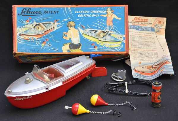 Boxed Schuco Ingenico Delfino 5411: Plastic, 10" long, includes instructions, 2 buoys with anchors, tether with steering wheel, original box, shows light playwear, C8