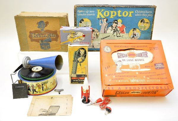 Boxed Unusual Toys: Bing Keimola record player, mechanism functional (not guaranteed), but needs adjustment. Appears complete with instructions, needles & key; Kopter optical science set; Bell Products Geiger Counter wit