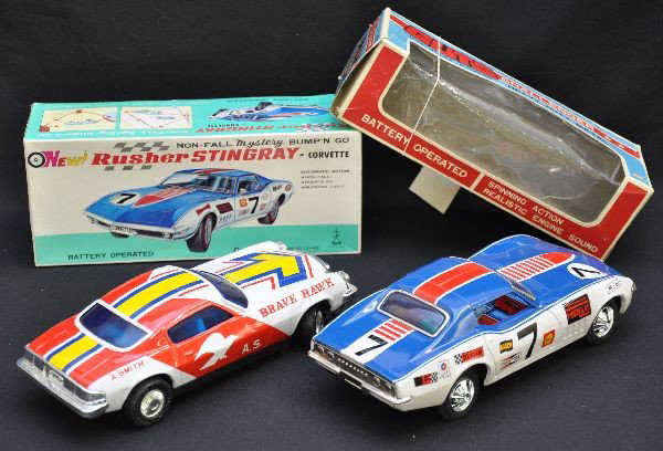 Boxed Camaro & Corvette Battery Ops: Asahi 1970 Camaro Challenger, tin, 9 1/2" long, rides in a circle then spins out with ship sound; Taiya Japan,10" 1969 Chevrolet Corvette Stingray, bump'n go action with blinking lights. Both are like