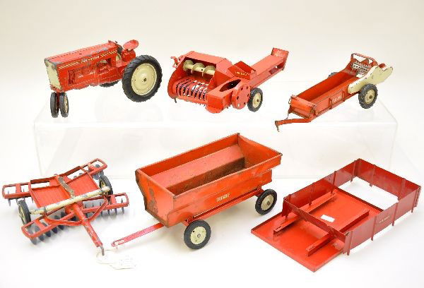 True Scale Tractor & Farm Equipment: Tractor; disc harrow; spreader; thatcher, trailer with hopper & open bodies. Hopper has some rust inside. Otherwise, all show moderate playwear, C6