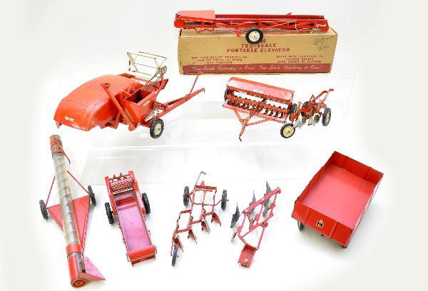 True-Scale Farm Accessories: E-410 portable elevator, ob; spreader; 3-section furrow; harvester trailer; two different seeders; trailer with open side body. All show light to moderate playwear, C7-8
