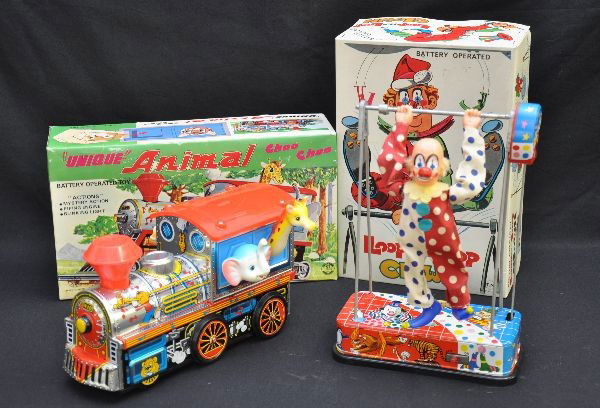 Boxed Battery Toys: TN Japan, Loop the Loop Clown, 10" tall; Kanto Japan, Unique Animal Choo-Choo. Both are functional (not guaranteed), and have their original boxes, Like new, C8+