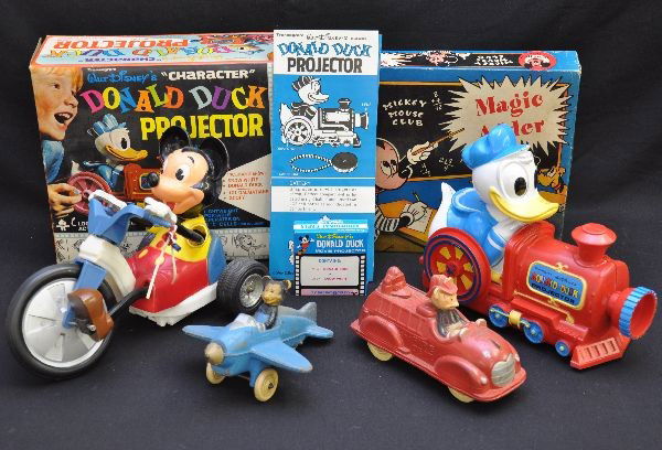 Piece Disney Toy Lot: Transogram Donald Duck projector, 9" plastic projector with boxed reel & instructions, ob; Jacman Mickey Mouse Club Magic Adder with insert & OB; Sun Rubber Mickey fire engine & airplane, plane missin