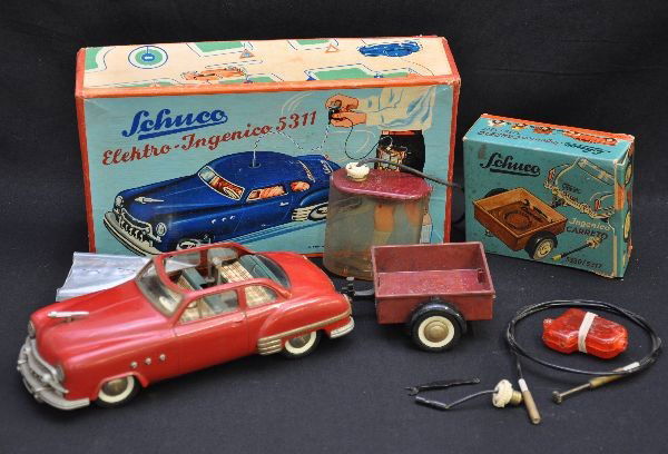 Boxed Schuco Ingenico & Trailer: 8 1/2" 1950s style Buick Electro-Ingenico battery vehicle, untested. Includes battery pack, tether, controller is in pieces, and nice original box; Ingenico Carreto trailer with wrench & power tether,