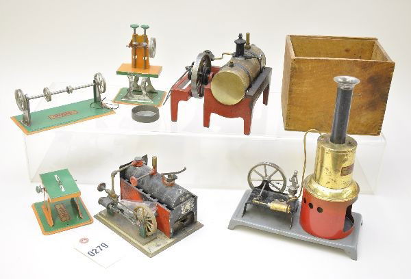 Weeden Live Steam Lot: Table saw, stamping press and transmission, like new C8; vertical steam engine, shows moderate playwear, C6; early partially boxed horizontal steam engine, 90% complete with burner, instructions & OB