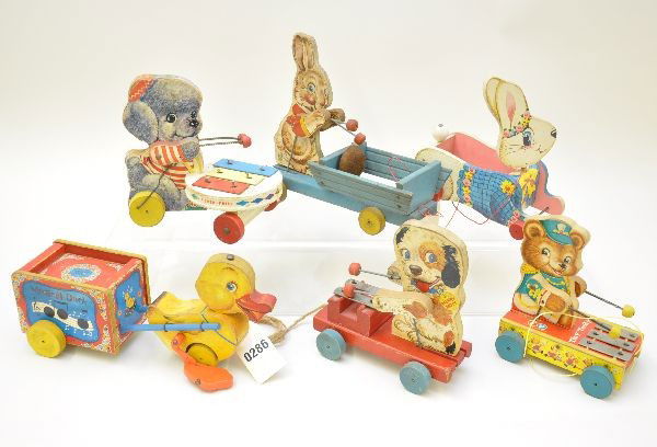 Fisher Price Toys: 795 musical duck, 508 bunny bell cart (bell rusty), 473 Merry Mutt xylophone, 307 Easter Bunny, 635 Tiny Teddy xylophone, 739 poodle xylophone. All show light to moderate playwear, all functional (not