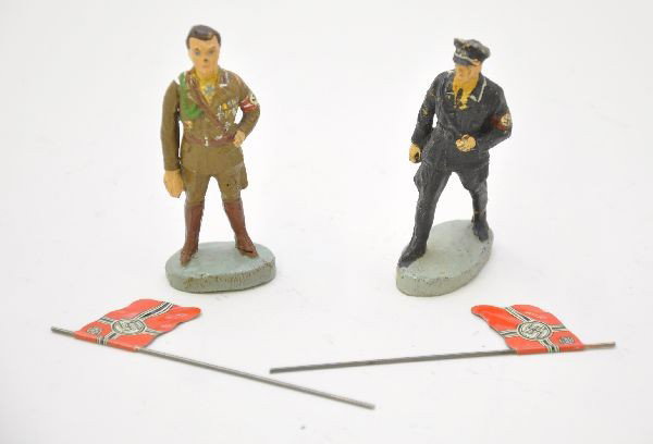 Elastolin Military Lot: SA Officer with saluting arm and a marching SS that has some cracks on legs and backs. Also includes two Nazi flags. Saluting figure shows light playwear, flags are like new, marching soldier shows mo