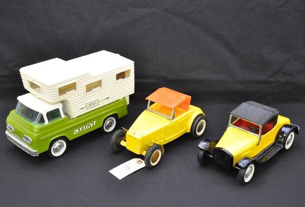 Ny-lint Vehicles: Trail Blazer camper, missing rear door, clean and shiny; Roadster with rumble sear, like new C8; street rod that shows moderate playwear, with rusty hub caps. Otherwise, C6-7