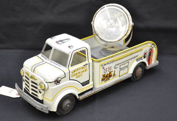 Marx Emergency Searchlight Unit Truck: Litho tin, 18" long with battery operated searchlight, untested. Frame has some rusts spots one side, litho is clean and shiny showing light to moderate playwear. Otherwise, C7