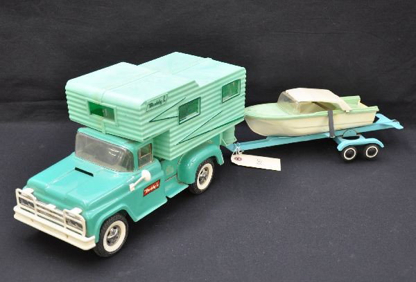 Buddy L and Tonka Truck & Trailer: Buddy L camper, rear steps missing one hinge nib, Tonka trailer with Buddy L boat. Trailer cap has a crack on one side but tough to see. Otherwise, all show light to moderate playwear, C7