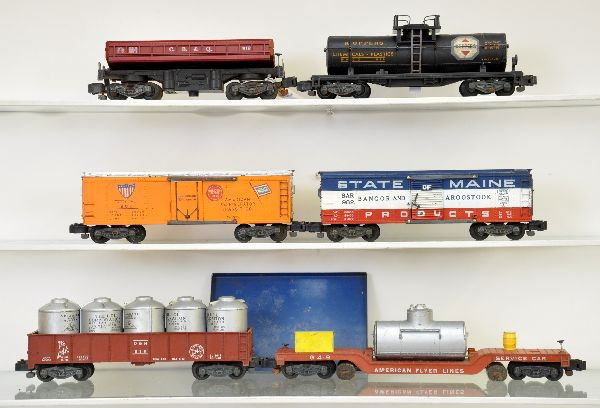 American Flyer Freight Cars: 986 ART reefer; 912 Koppers chemical tank car, plastic frame; 948 track cleaner; 919 coal dump car with bin; 916 D&H container car; 982 SOM boxcar, small chip in catwalk end. Otherwise, all show light