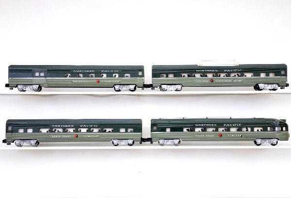 American Flyer NP Passenger Cars: S-Gauge. 900 combine; 901 coach; 902 Vista-Dome; 903 observation. All are clean & shiny, but have light damage from adhesive vestibule removal. Otherwise, shows light to moderate playwear, C7