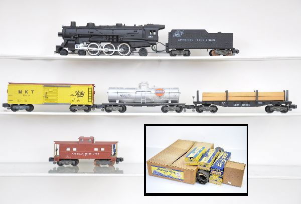 Boxed American Flyer Set 20320: S-Gauge. 283 C&NW Pacific steam loco; 925 Gulf tank car, some mildew; 928 NH flat with lumber; 937 MKT boxcar; 977 action caboose, later figure; track, peripherals, and OSB. Otherwise, all show light