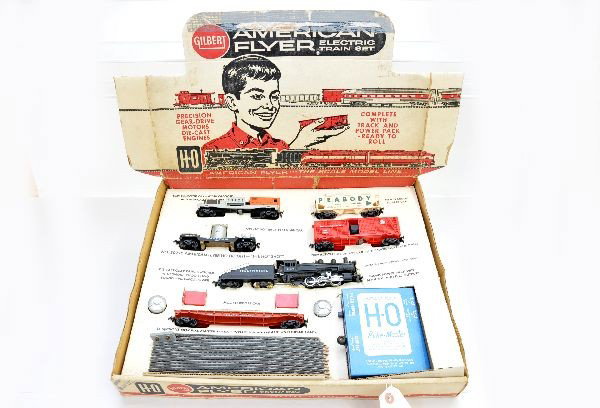 Boxed American Flyer HO Set 30720: 31004 PR steam switcher; 33215 Peabody hopper; 33558 multi-purpose car; 33818 GN Hay Jector with 2 bales; 33537 transformer car; 33820 Tie-Jector with 3 ties, track & transformer and instructions. Tra