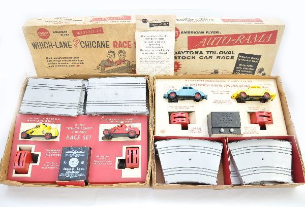 Boxed A.C. Gilbert Slot Car Sets: 19070 Daytona tri-oval stock car set, complete & lightly used; M5665 Which-Lane Chicane Set is also complete showing light playwear. Both have set boxes with display inserts, some dirt, C7-8