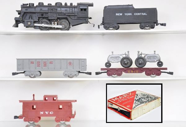Boxed Marx Set 14350: 400 loco, powder smoke unit, NYC tender, PR gondola, flat with silver tractors, NYC caboose, 073 boxed boulevard lamps, telephone poles and signs, track, transformer, osb with inserts, worn. Trains sh