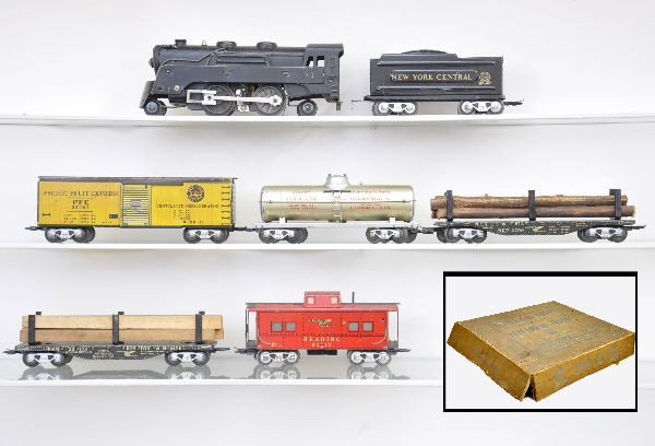 Boxed Pre-War Marx Scale Set: Includes: 391 loco, some wheel fatigue, NYC wedge tender, old lettering, NIAX tank car, silver frame, B&M black lumber and NKP flat with logs, both missing hold-downs, PFE reefer, Reading caboose, ins