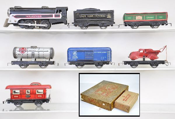 Boxed Marx Set 4999: Includes Marlines steam loco, wedge tender, gondola, tank car, rare flat with wrecker, B&O boxcar with sleeve, 556 caboose, boxed 510 switches, track, transformer, OSB. Shows light to moderate wear, C