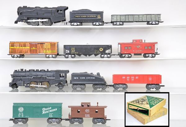 Boxed Marx Sets 25040 & 50242: 25040 includes 898 steam loco, wedge tender with gold lettering, hopper, stock car, B&O gondola, Reading caboose, track, transformer; Set 50242 includes 1666 steam loco, NYC slope back tender, GN boxc