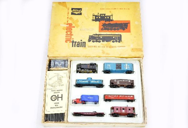 Boxed Marx HO Allstate Set 9942: NH Steam switcher; B&M boxcar; Allstate tank; Virginian hopper; WM gondola; Erie flat with Burlington tractor trailer; NH bay window caboose with stack, track & transformer set box with inserts, shows