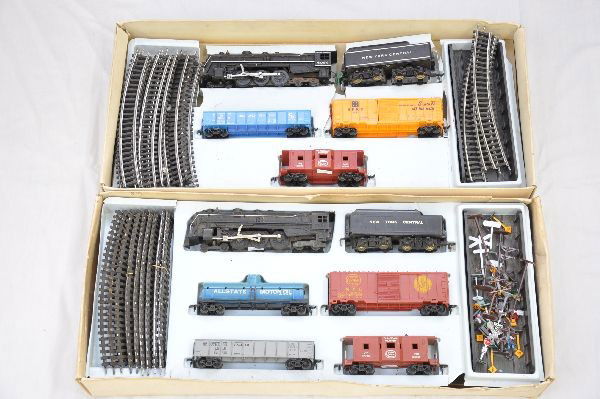Boxed Marx HO Sets: Uncataloged set includes 6096 Hudson loco & tender; Allstate tank car; brown NYC boxcar; SP gondola; NYC bay window caboose, stack broken, track & trestles with accessory set; Set 9962 includes 6096 N