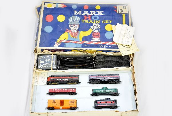 Boxed Marx HO Set 4642/1: Includes RI F3 AB diesels; WM gondola; CS tank car; SF boxcar; RI caboose, roadbed track, transformer, worn set box with inserts. Trains show light to moderate wear, C7-7+