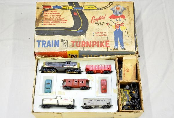 Boxed Marx HO Trains n Turnpike Set: Set 71445, includes NP GP7 diesel; WM hopper; rocket fuel tank car; cement car; NP bay window caboose; Ford Thunderbird & 1963 Corvette, train & slot car track, no trestles, controllers, set box with