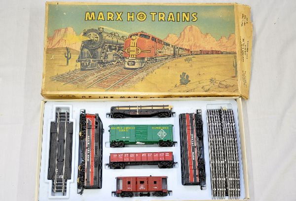 Boxed Marx HO Set 64652: Includes RI F3 AB diesels; LV railed flat with lumber; REA boxcar; WM gondola; IR bay window caboose, track, set box with insert. Trains show light wear, C8
